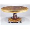 Image 1 : An early Victorian mahogany breakfast table, the round tilt top with a moulded edge on a lappet c...