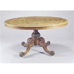 A Victorian walnut oval breakfast table, the quarter veneered burr walnut top with marquetry and...