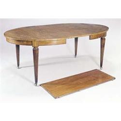 A French satinwood and tulipwood crossbanded extending dining table with two loose leaves, with b...