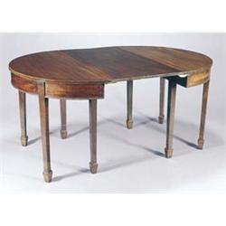 A mahogany "D" end dining table in George III style with one loose leaf and a plain frieze, on sq...