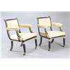 Image 1 : Two French ebonised and parcel gilt open armchairs in early 19th century style, each with a reede...
