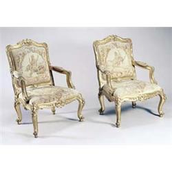 Four giltwood open armchairs in Louis XV style, each carved overall with scrolls, flowers and lea...