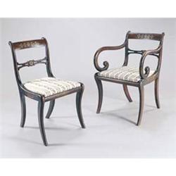 A set of five George IV simulated rosewood dining chairs each with a brass marquetry crest and ba...