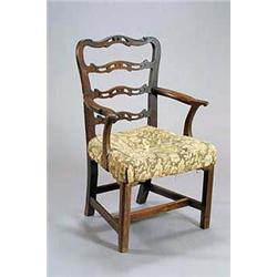 A George III mahogany country made elbow chair, with pierced ladder back, shaped arms, padded sea...