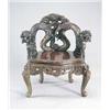 Image 1 : A 20th century Chinese elbow stained wood elbow chair, the curved back carved with dragons chasin...