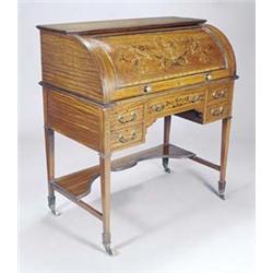 A late Victorian Sheraton revival satinwood and marquetry cylinder desk, the roll top enclosing a...