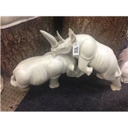 RHINO PAIR, HAND CARVED FROM KENYAN SOFT STONE. 17" TALL 28" LONG