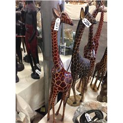 GIRAFFE, HAND CARVED FROM A SINGLE PIECE OF AFRICAN MAHOGANY. 48" TALL