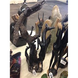 THE HUNTER AND THE HUNTED, HAND CARVED FROM A SINGLE PIECE OF AFRICAN EBONY. 27" TALL