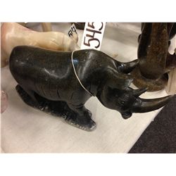 RHINO, HAND CARVED FROM SPRING STONE 12  LONG 5  TALL