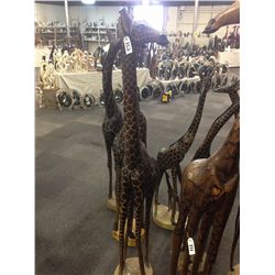 GIRAFFE, CARVED FROM A SINGLE PIECE OF AFRICAN MAHOGANY, 74" TALL
