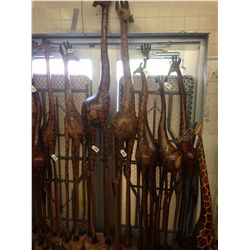 GIRAFFE, CARVED FROM A SINGLE PIECE OF AFRICAN MAHOGANY, 95" TALL