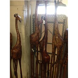 GIRAFFE, CARVED FROM A SINGLE PIECE OF AFRICAN MAHOGANY, 85" TALL