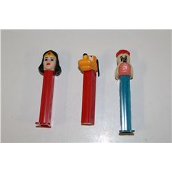 3 VINTAGE PEZ DISPENSERS INCLUDING: WONDERWOMAN, GOOFY (WITH MOVEABLE EARS) AND DROOPY