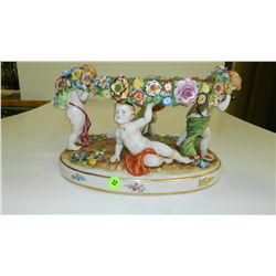 lovely hand painted antique porcelain putti figural center piece bowl holder, by Schierholz 7x12x7