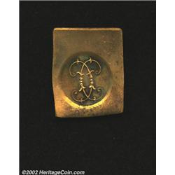 Uniface klippe trial strike in yellow copper of the Royal cipher (initials) of Prince Charles. This 