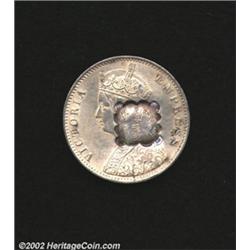 Scalloped square with an Arabic inscription counterstamped on an British India 1901 rupee,
