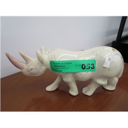 Carved stone rhinoceros statue