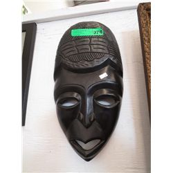 Carved black wall mask