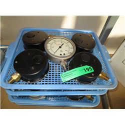 Four trays of pressure gauges