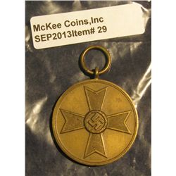 29. 1939 Nazi Germany Medal with Swastika. "Fur Kriegs Verdien 1939".