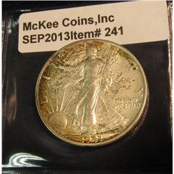 241. 1941 D Walking Liberty Half Dollar. Nicely toned AU.