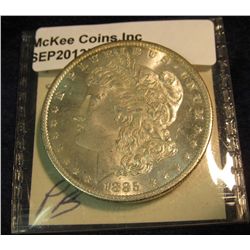 1523. 1885 O Morgan Silver Dollar. Semi-Prooflike MS 65.