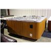 Image 1 : 92" X 92" CAL SPAS AQUA SERIES HOT TUB WITH SUNSET STORM INTERIOR AND TEAK CABINET.