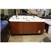 Image 1 : 84" X 84" CAL SPAS COLEMAN SERIES HOT TUB WITH SNOW WHITE INTERIOR AND MAHOGANY CABINET.