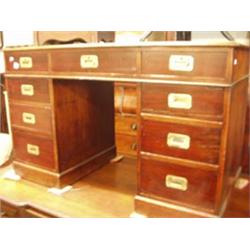 Nine drawer mahogany desk with brass inset handles, 4x2ft £400-600...