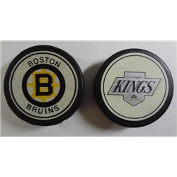 Vintage Los Angeles Kings & Boston Bruins Pucks.