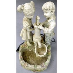 Cast Fountain with Boy & Girl at Pump.
