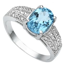 FINE 7X9MM OVAL BLUE TOPAZ & DIAMOND ACCENT RING