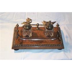 OAK DESK TOP INKSTAND, with two glass wells, both surmounted with gold Eagles. 60 - 80...