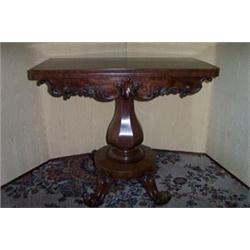 EARLY VICTORIAN MAHOGANY CARD TABLE, the fold over swivel top on a faceted tapered column, with a...