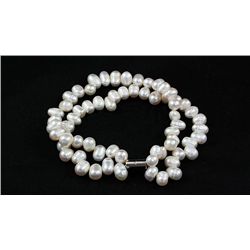 149.10CTW 7in. WHITE TWISTED RICE PEARL BRACELET