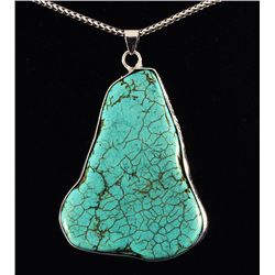 84.76CTW BIG SLICE TURQUOISE IN SILVER BEZEL PENDANT