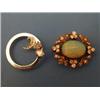 Image 1 : An open circular brooch set with two teardrop diamonds and a crescent of smaller diamonds, (illus...