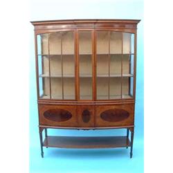 An Edwardian mahogany boxwood and ebony line inlaid display cabinet with dentil moulded cornice a...