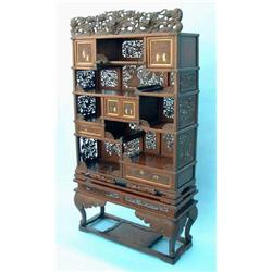 A mid 19th century Chinese carved hardwood and silver wirework inlaid display cabinet, fitted cup...