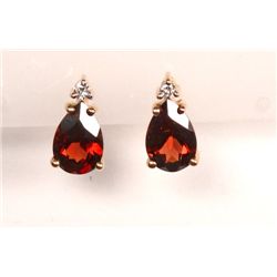 Preowned 14K yellow gold Garnet Earrings with diamond accent.