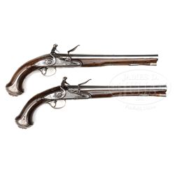 PAIR OF FULL SILVER MOUNTED ENGLISH FLINTLOCK PISTOLS BY JOHN HARVEY OF EXETER CIRCA 1780.