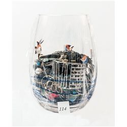Large glass cup filled with assorted costume