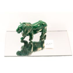 Polished green stone carved lion figurine