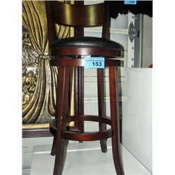 Swivel bar stool with black padded leather seat