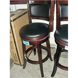 Swivel bar stool with black padded leather seat