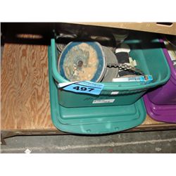 Small green tote containing misc plumbing