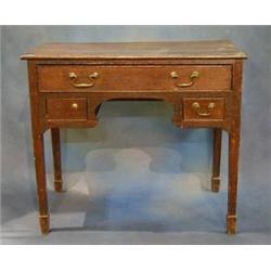 An 18th Century Country oak low boy, fitted 1 long drawer above 2 short drawers, raised on square...