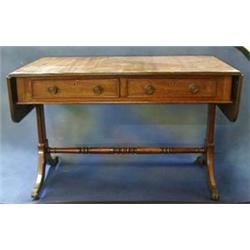 A 19th Century sofa table fitted 2 drawers, raised on standard end supports united by a stretcher...