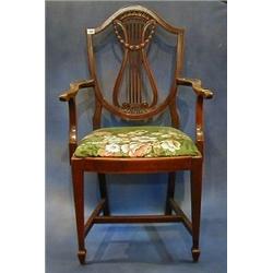 A set of 8 Edwardian mahogany Hepplewhite style dining chairs with lyre shaped pierced splat back...